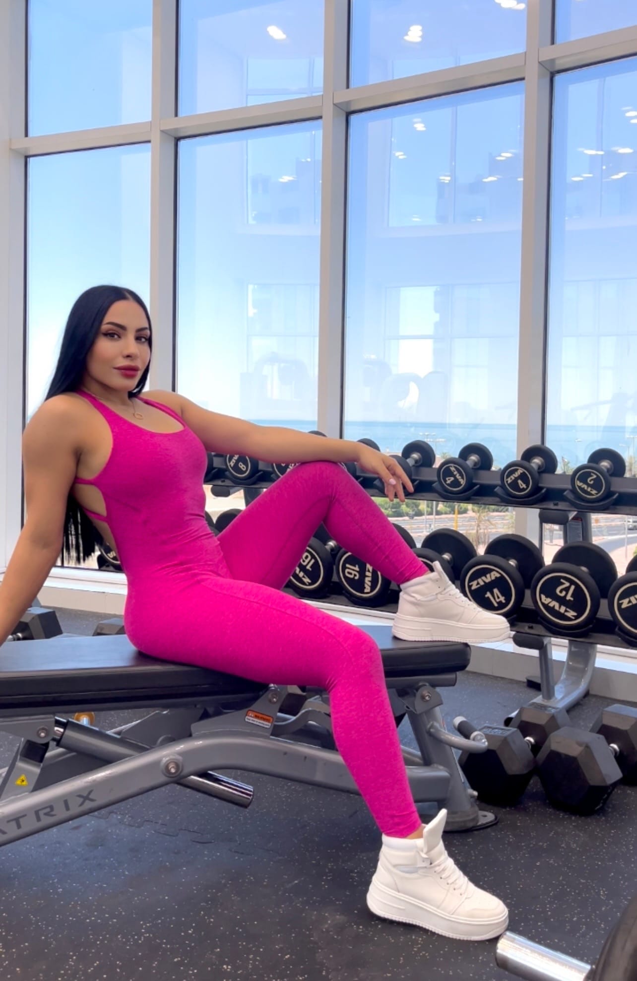 Marwa Ben Said seated in the gym in pink athletic wear